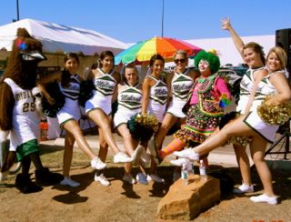 Photo - Greenie with a group of cheerleaders